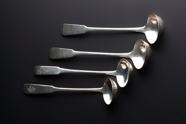 Appraisal: A PAIR OF SILVER TODDY LADLES with oar end handles