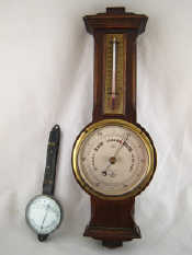 Appraisal: A s oak cased aneroid barometer and thermometer by Short