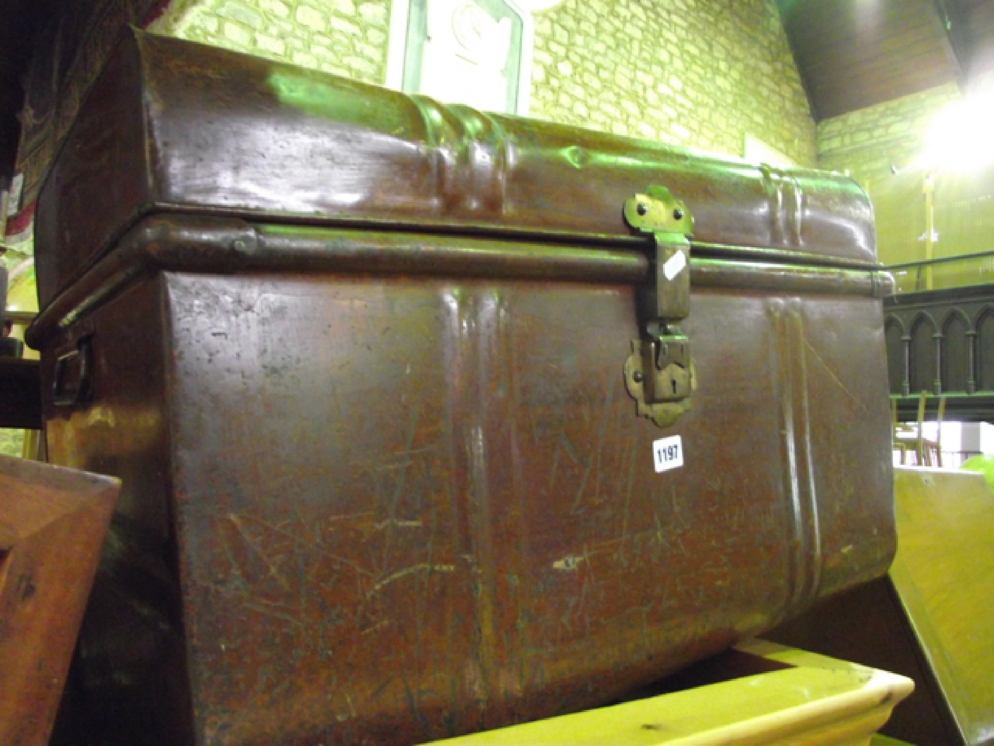 Appraisal: A Victorian tin travelling trunk with original wood grained finish