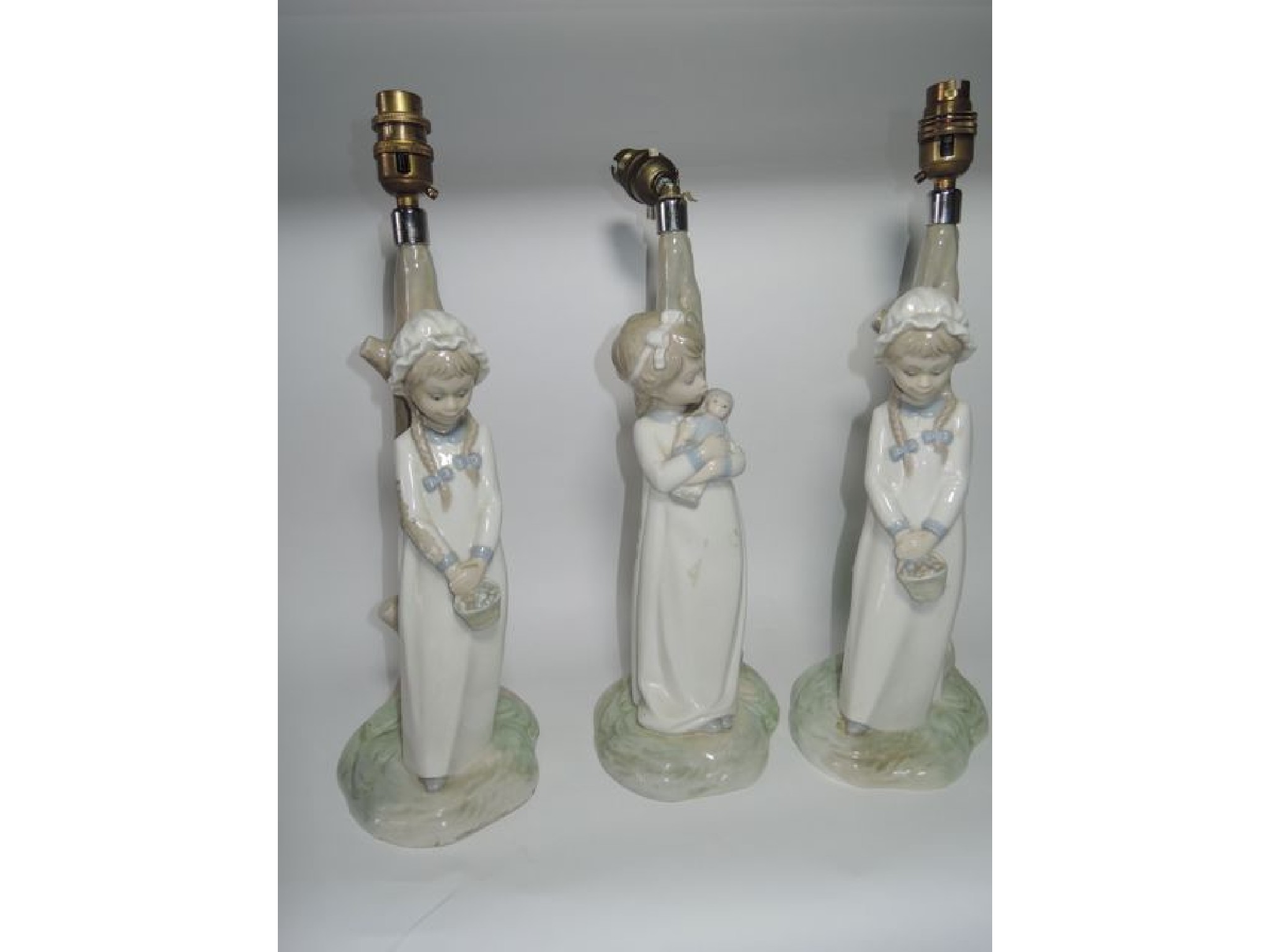 Appraisal: A pair of Lladro style Spanish ceramic lamp bases in