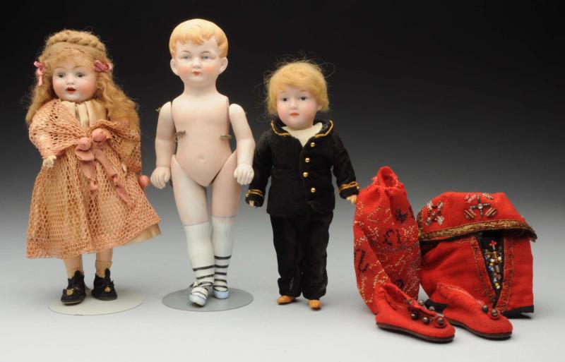 Appraisal: Lot Of Bisque Dolls Gebr Heubach character boy with square