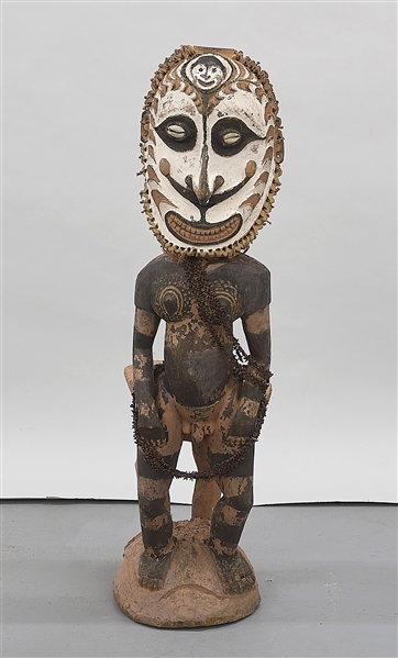 Appraisal: Carved wood standing masked figure from Papua New Guinea H