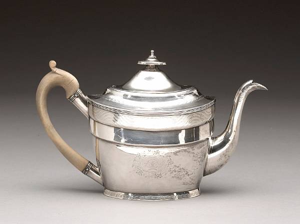 Appraisal: A George III silver teapot with wooden handlePeter Ann amp