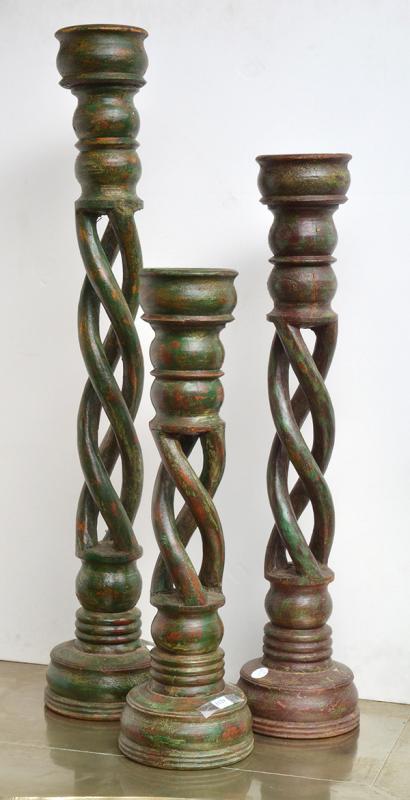 Appraisal: A GROUP OF THREE INDIAN MULTI-TWIST CANDLESTICKS each on a