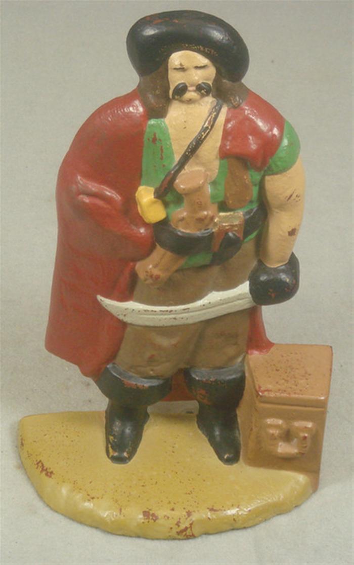 Appraisal: Cast iron doorstop pirate with gun and treasure chest on