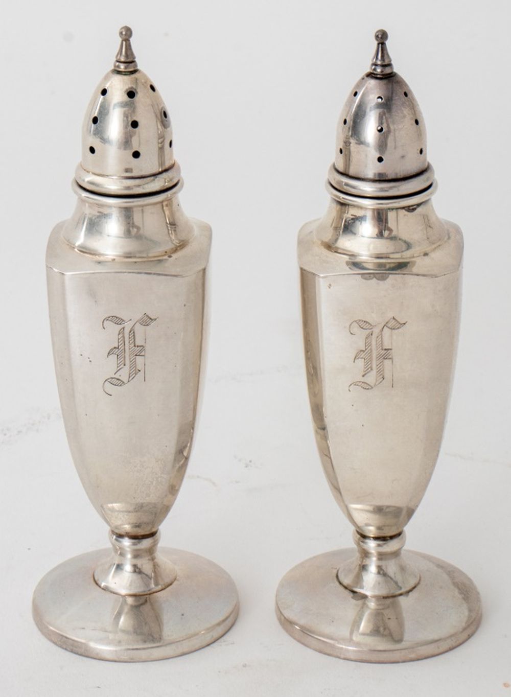 Appraisal: MUECK-CARY STERLING SILVER SALT AND PEPPER SHAKERS Mueck-Cary sterling silver