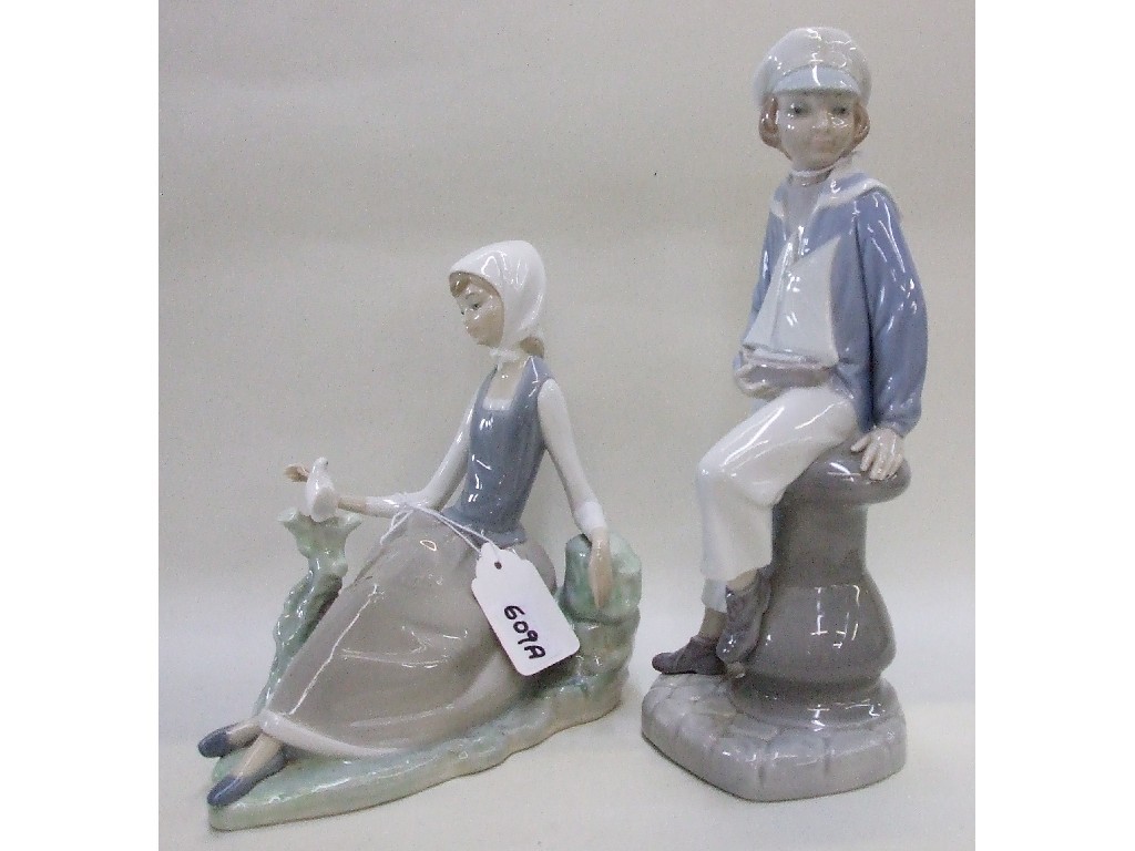 Appraisal: Lladro figure of a boy and boat and another of