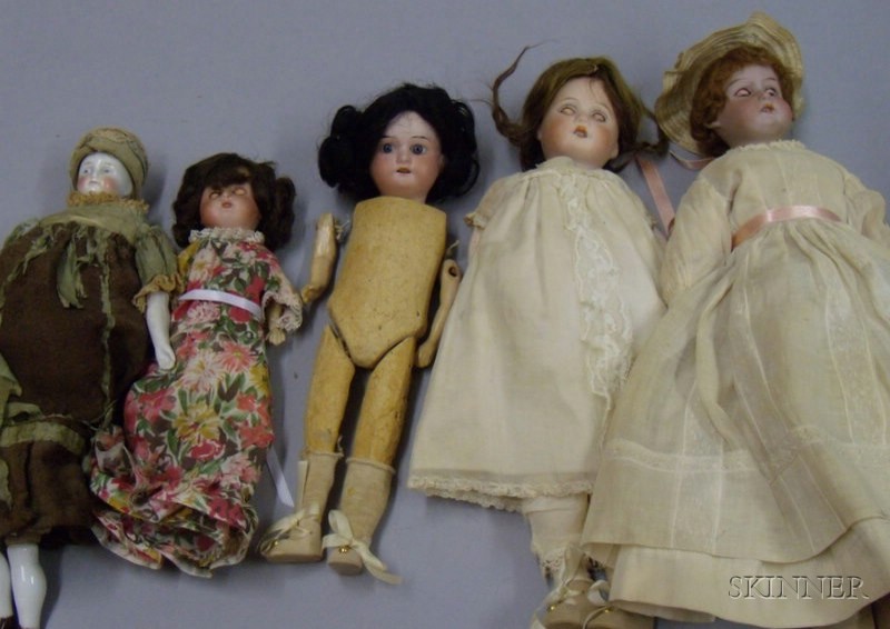 Appraisal: Four Assorted Dolls including a Biedermeier-type china shoulder head with