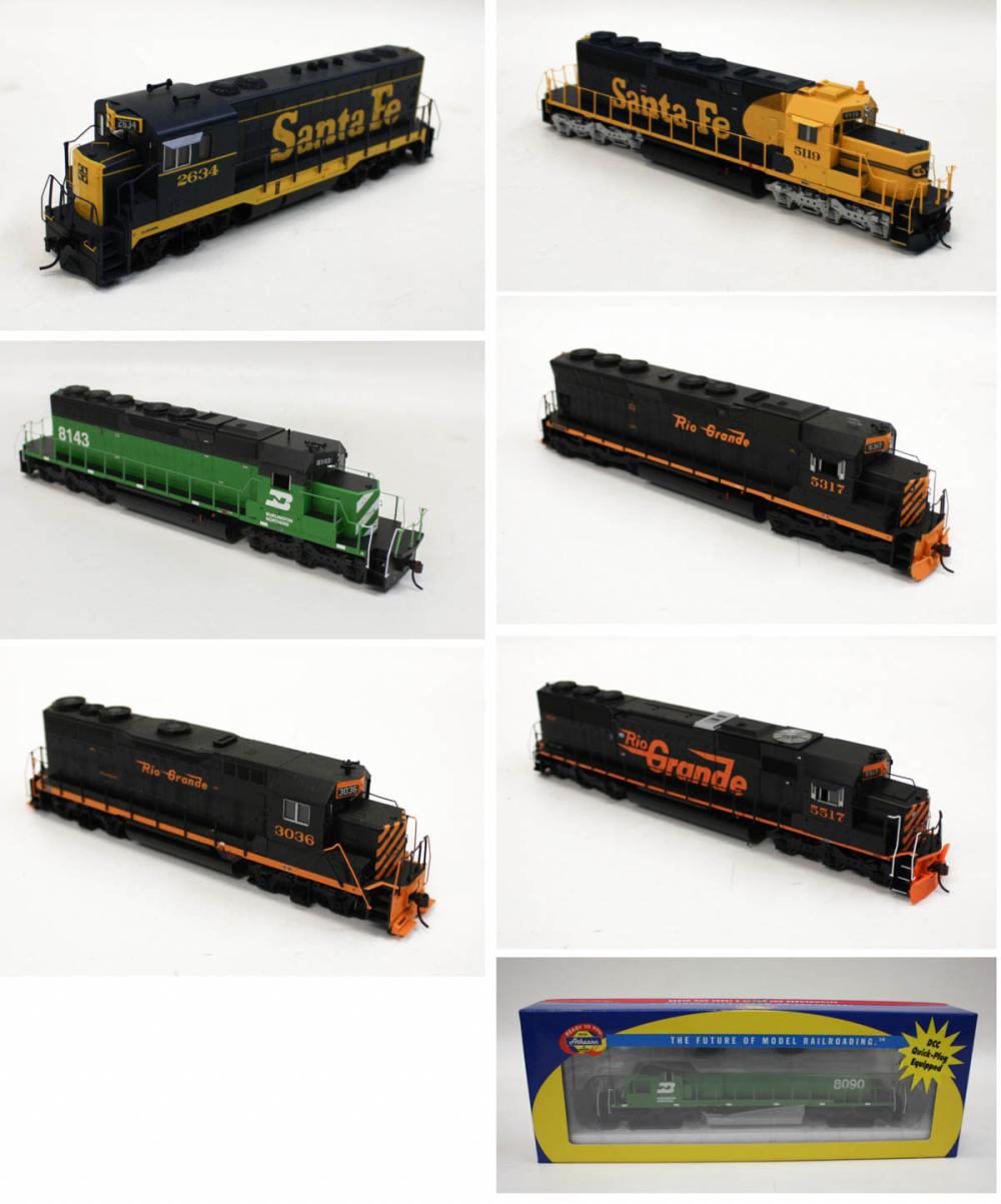 Appraisal: SEVEN HO GAUGE MODEL TRAIN ENGINES All Athern Santa Fe