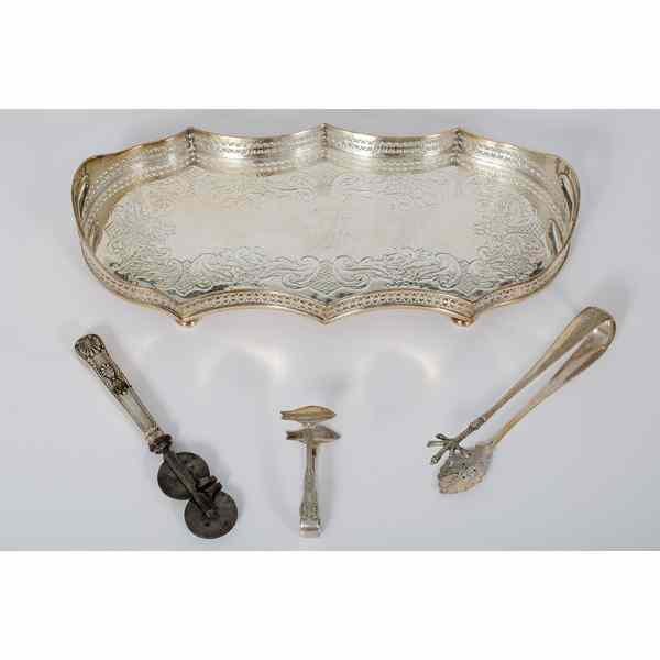 Appraisal: Silver-Plated Serving Tray and Tablewares An ornate silver-plated handled tray