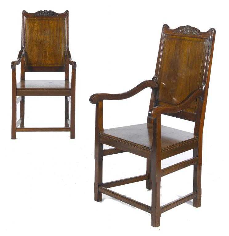 Appraisal: A PAIR OF VICTORIAN MAHOGANY HALL CHAIRS crested by a