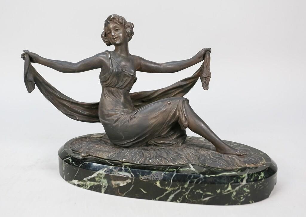 Appraisal: French white metal sculpture seated lady with shawl Foundry mark