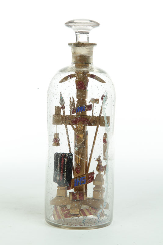 Appraisal: BOTTLE WHIMSEY American glass wood glitter and paper Gold-painted crucifixion