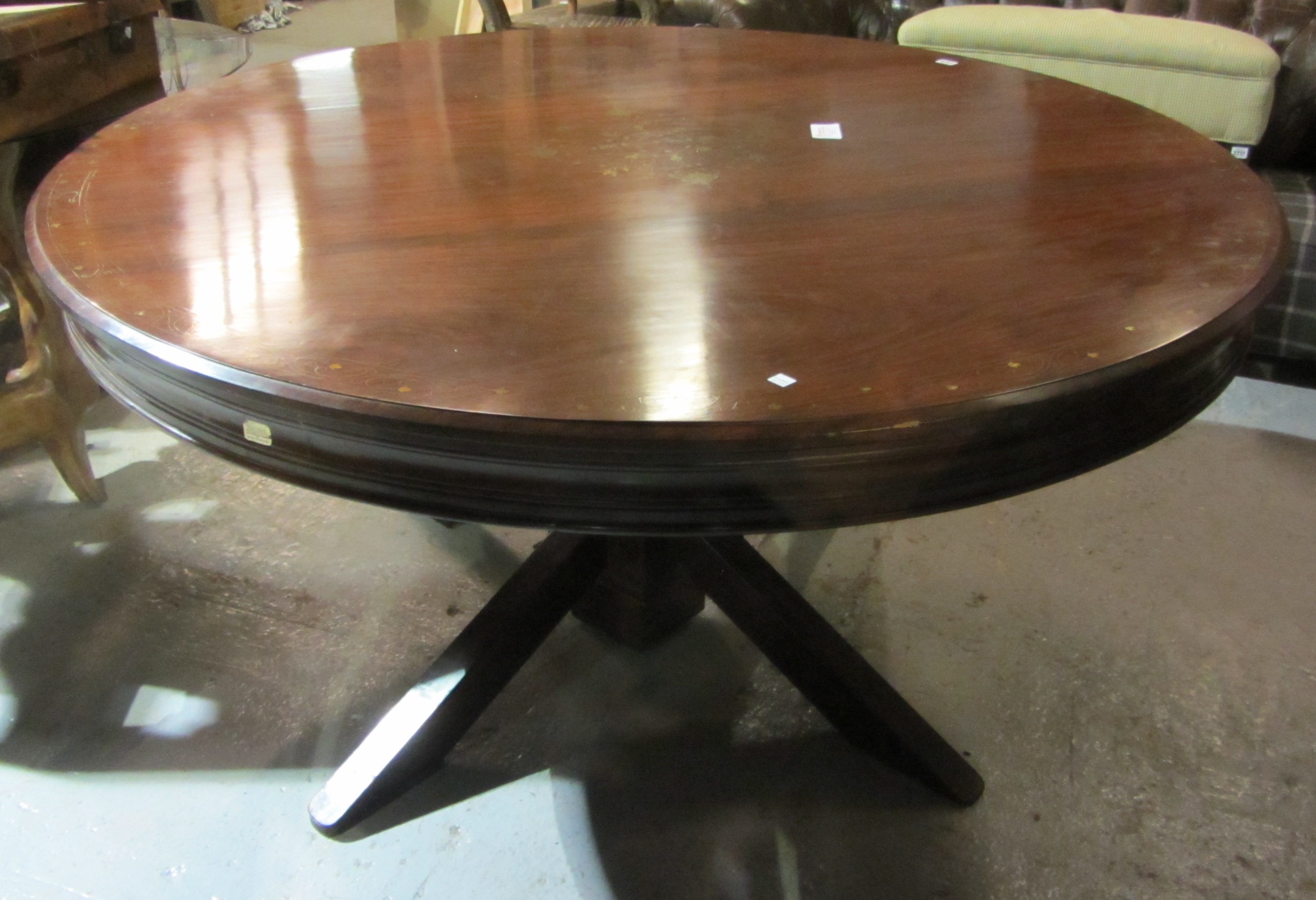 Appraisal: A th century circular hardwood dining table