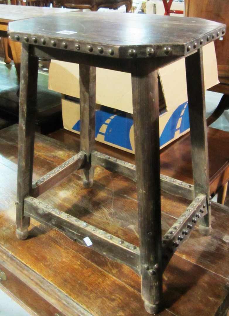 Appraisal: An oak occasional table with brass studs