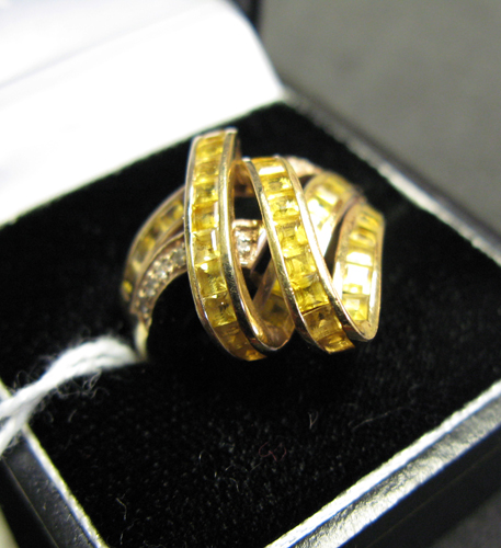 Appraisal: CITRINE DIAMOND AND FOURTEEN KARAT GOLD RING set with square-cut