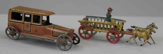 Appraisal: FISCHER SALOON AND HORSEDRAWN CART PENNY TOYS Lithographed tin brown