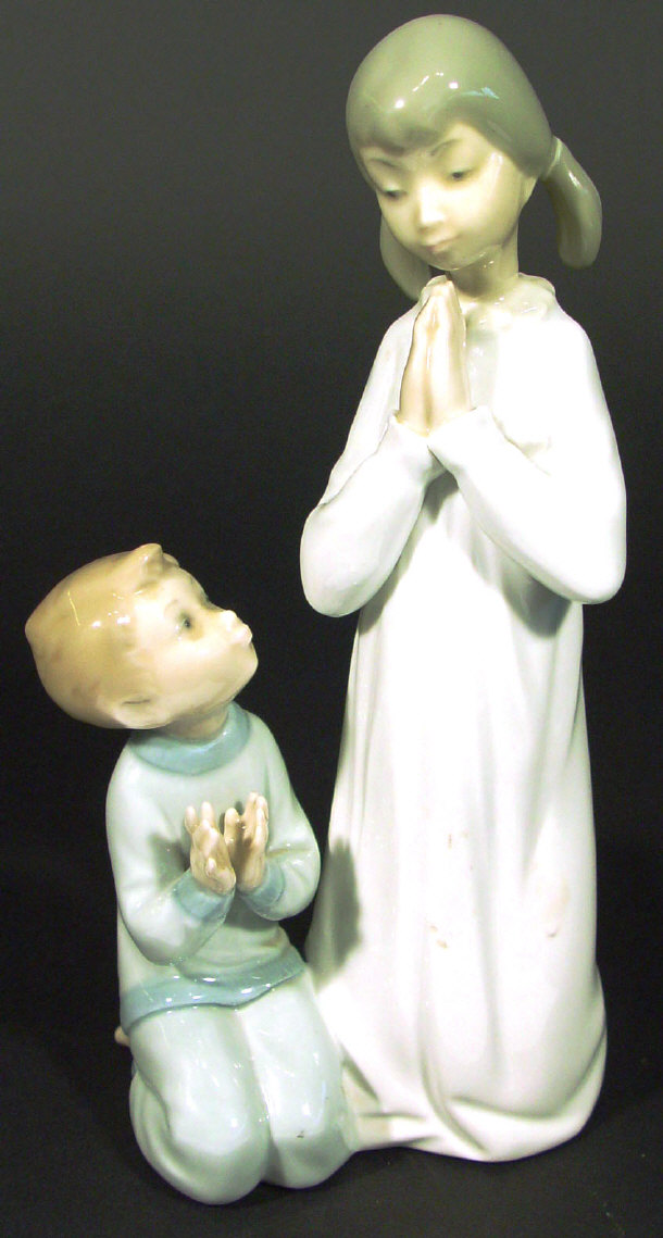 Appraisal: Lladro porcelain figure group of a young girl and boy