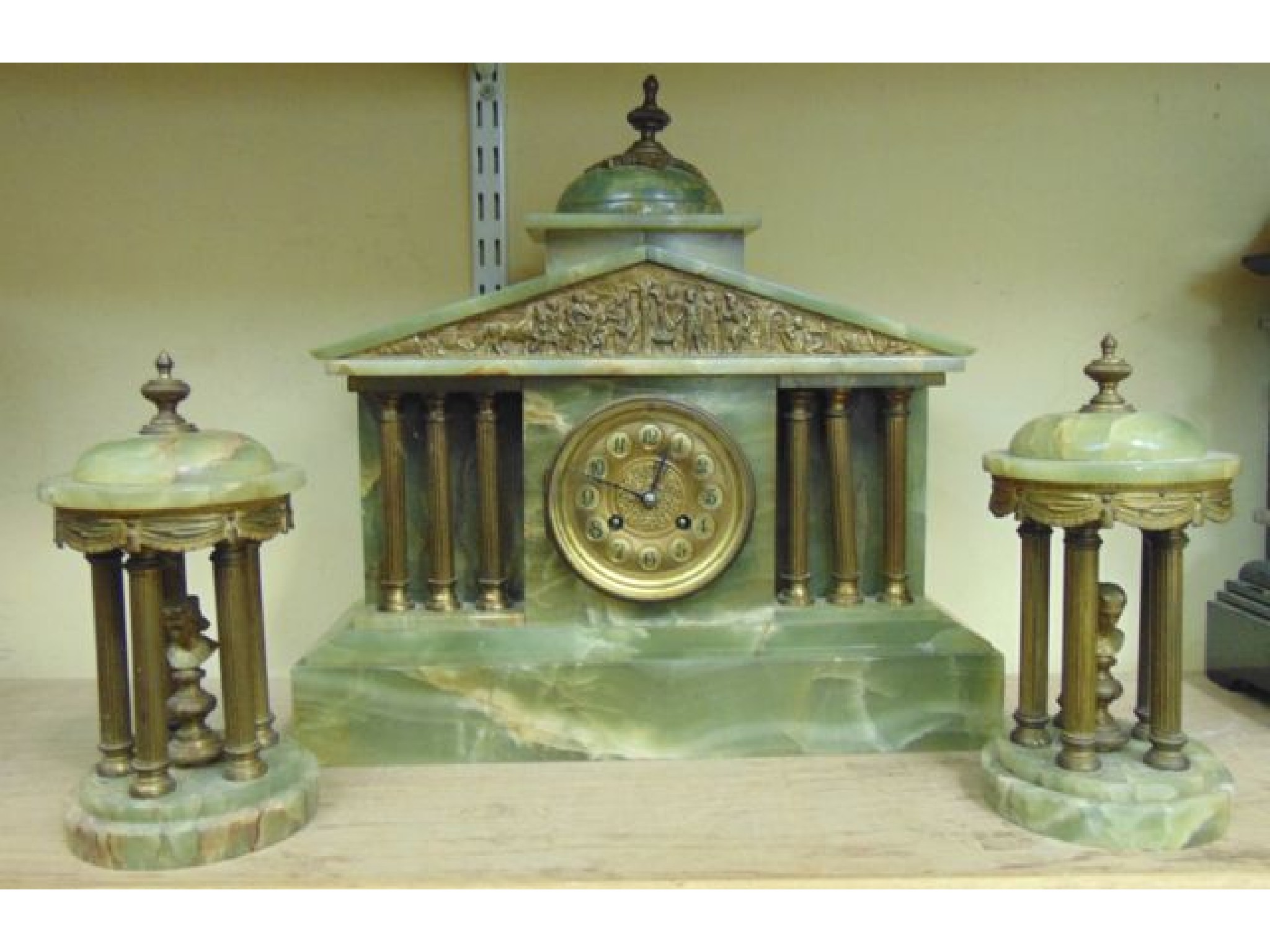 Appraisal: A late th century green onyx clock garniture the clock