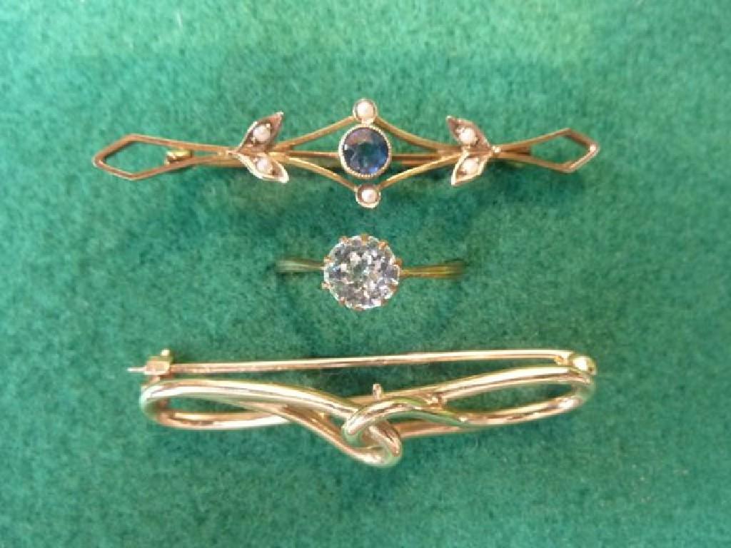 Appraisal: Two ct gold bar brooches one set with sapphire and