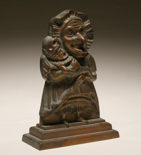 Appraisal: Cast bronze Punch and Judy doorstop embossed Judy figure holding