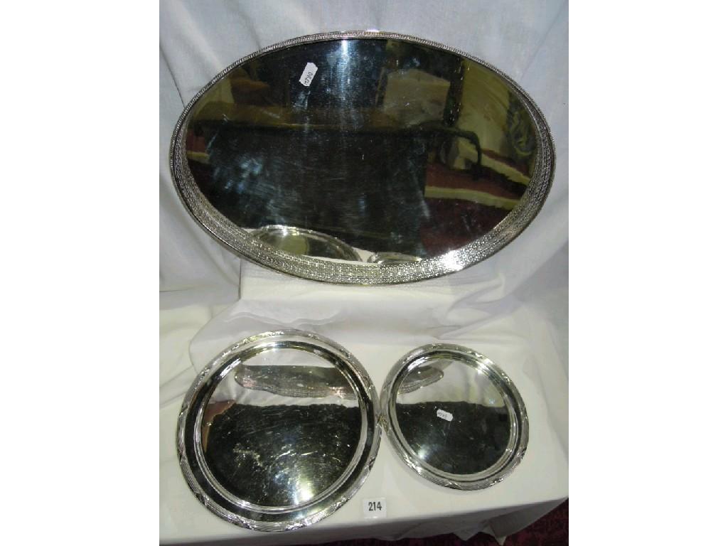 Appraisal: A silver plated oval gallery tray together with a set