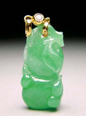 Appraisal: CARVED JADEITE PENDANT Delicately carved Chinese jadeite pendant double gourd