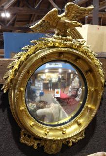 Appraisal: Federal convex looking glass the giltwood form surmounted with a