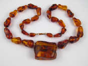 Appraisal: An amber bead necklace largest piece approx x cm approx