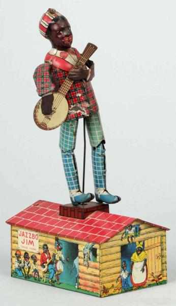 Appraisal: Tin Unique Art Jazzbo Jim Roof Dancer Wind-Up Toy Description