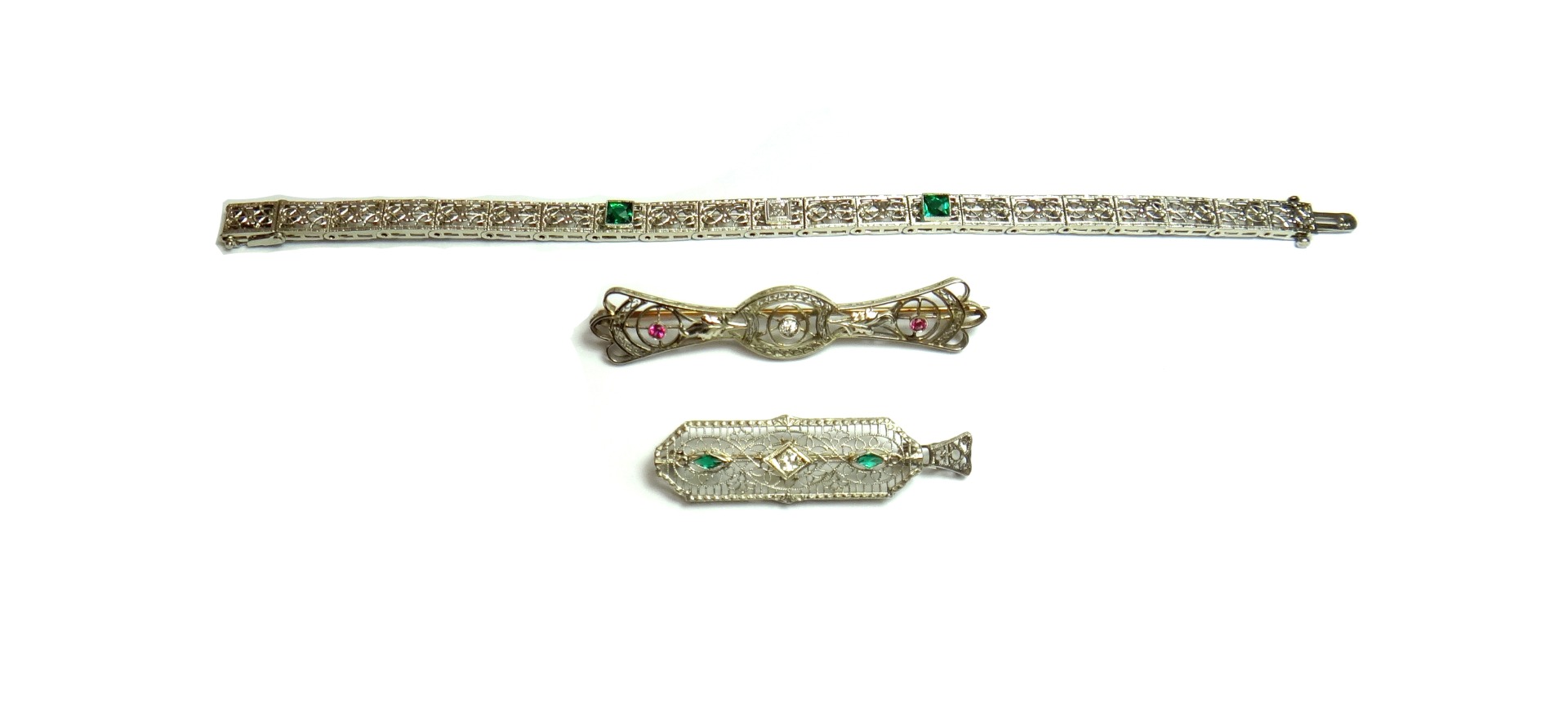 Appraisal: A white gold diamond and garnet topped green paste doublet