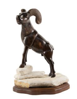 Appraisal: AN IRONWOOD CARVED BIGHORN SHEEP ON ROTATING BASE AN IRONWOOD