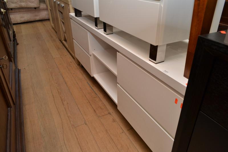 Appraisal: A CONTEMPORARY WHITE LOW SIDEBOARD WITH FOUR DRAWERS A CONTEMPORARY