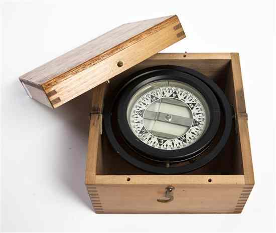 Appraisal: A Cased Ship's Compass Polaris having a circular dial Diameter