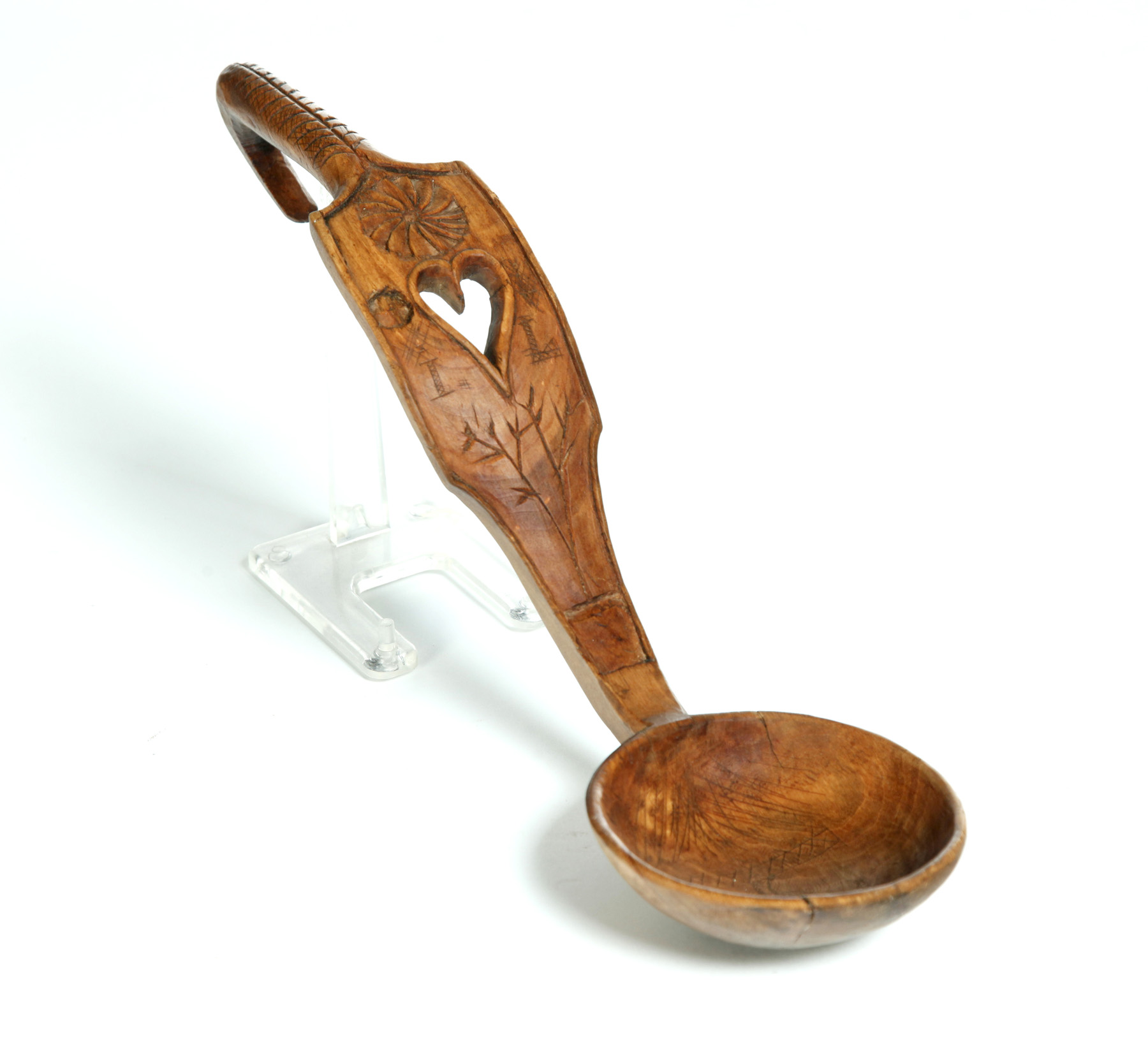 Appraisal: CARVED WOODEN LADLE Possibly American th century Pierce carved handle