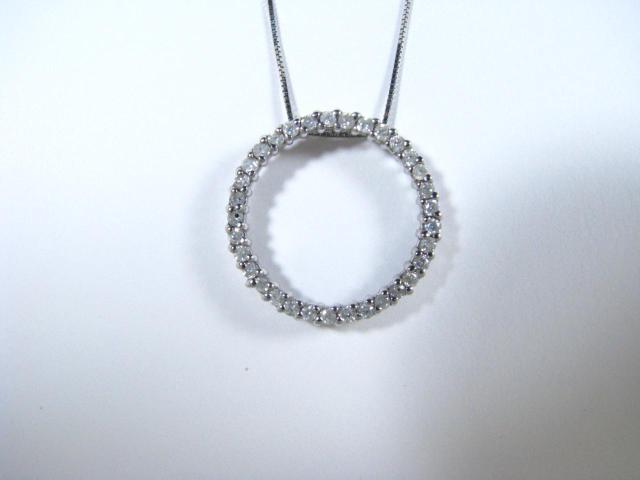 Appraisal: K White Gold Circle Pendant with small diamonds on K