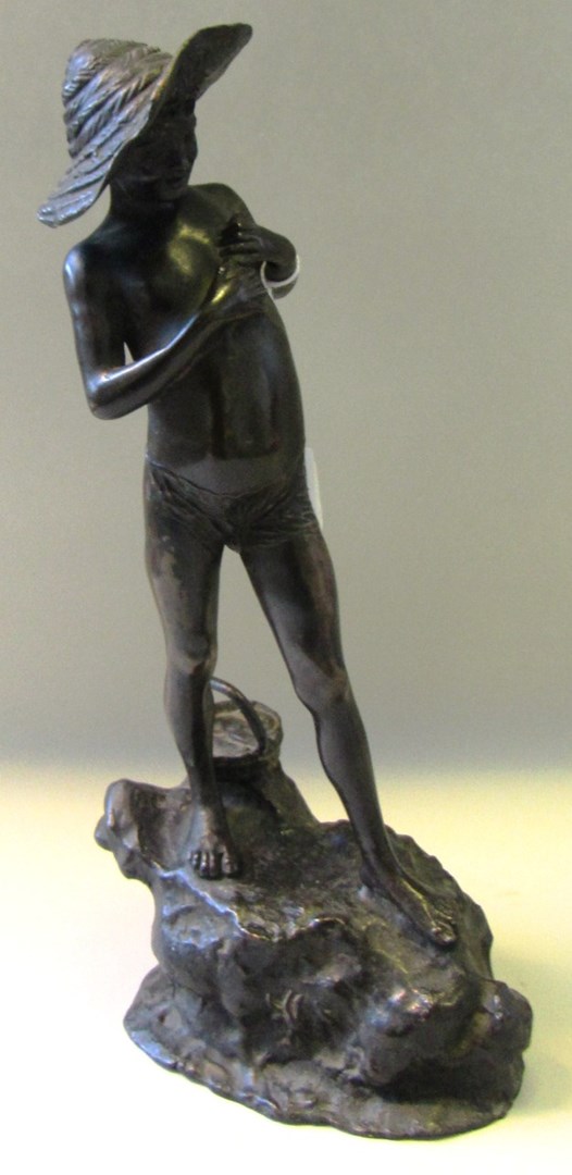 Appraisal: A bronze model of a boy with a fish early