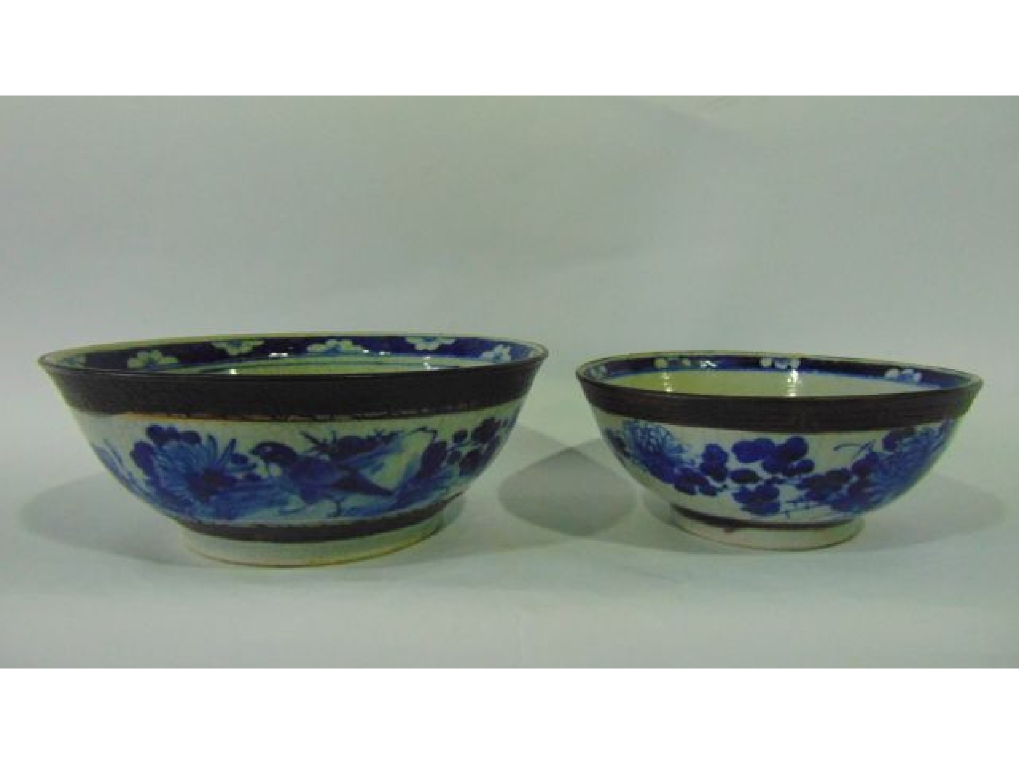 Appraisal: Two graduated th century oriental bowls with crackle glazed finish