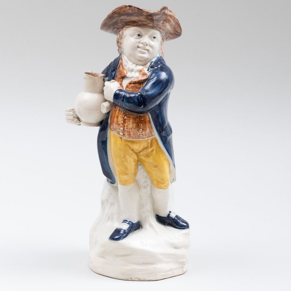 Appraisal: George III Staffordshire Pearlware Toby Jug in high Sold Stair