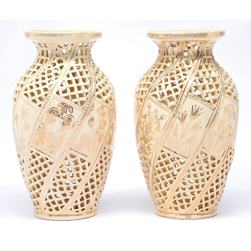 Appraisal: A pair of Fischer reticulated vases c shouldered oviform and