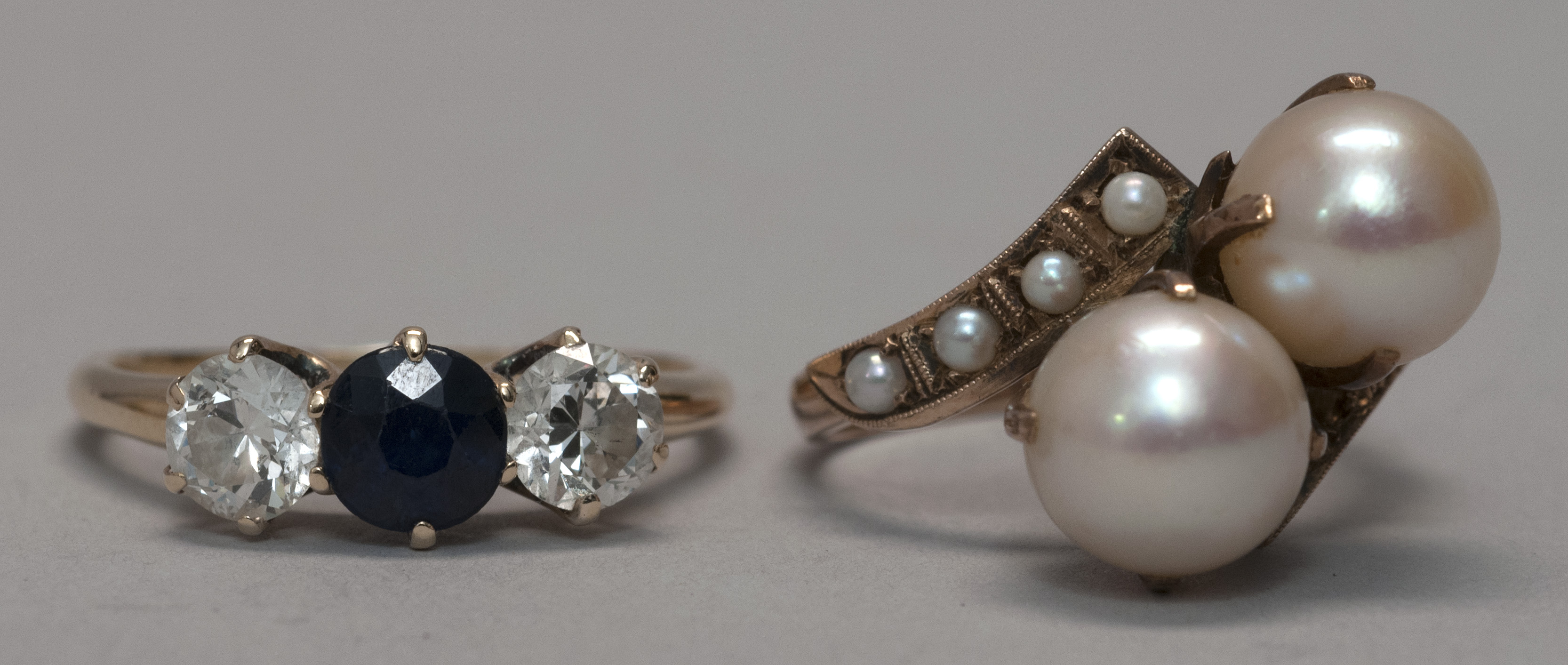 Appraisal: TWO GEM-SET KT GOLD RINGS One with two diamonds flanking