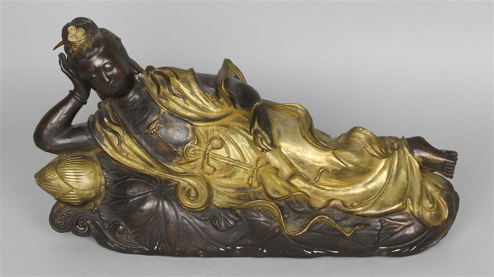 Appraisal: CHINESE BRONZE FIGURE OF A RECUMBENT GUANYIN the supine deity