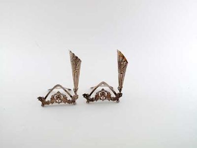 Appraisal: A pair of late Victorian cast menu card holders and