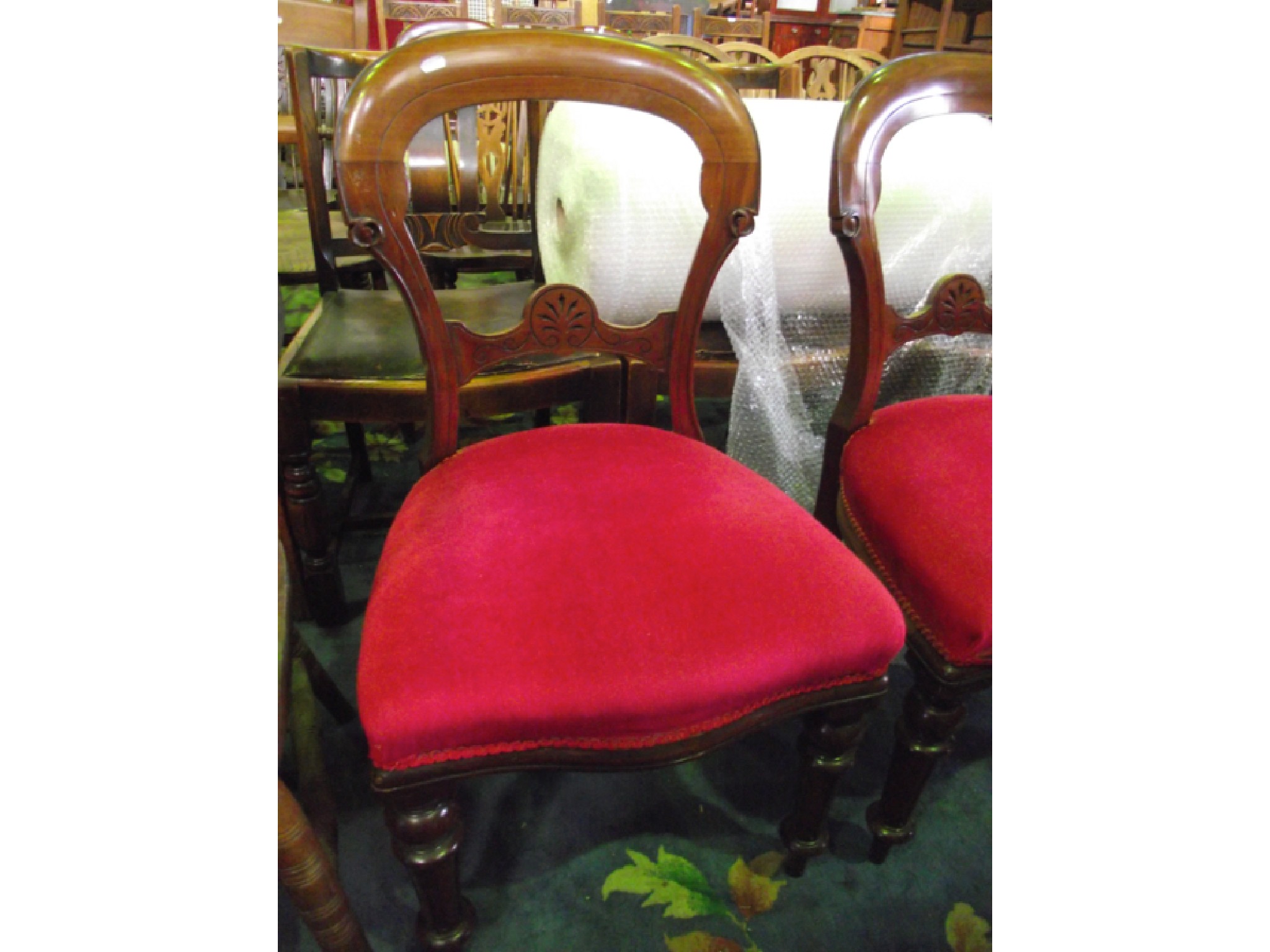 Appraisal: A set of four Victorian mahogany balloonback dining chairs with