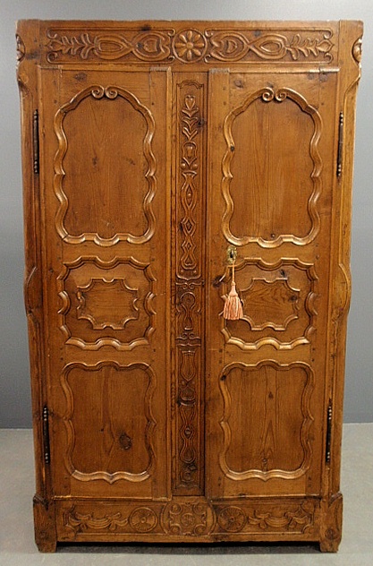 Appraisal: - French Provincial pine armoire th c with ornately carved