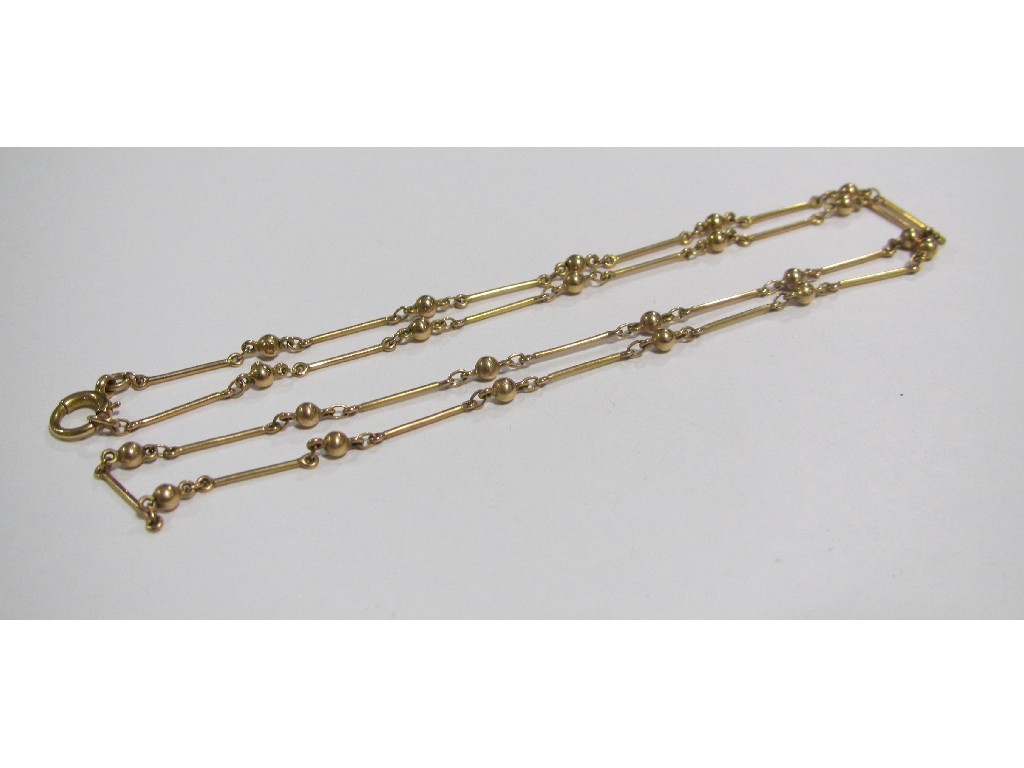 Appraisal: Fifteen carat gold neckchain with bars and ball spacers Approximately