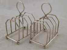 Appraisal: A pair of silver toast racks by Bradbury and Sons