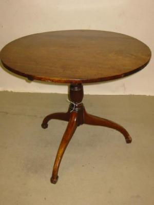 Appraisal: A GEORGE III MAHOGANY TRIPOD TABLE the circular tip up