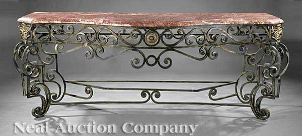 Appraisal: A Monumental Wrought Iron and Bronze-Mounted Console Table molded serpentine