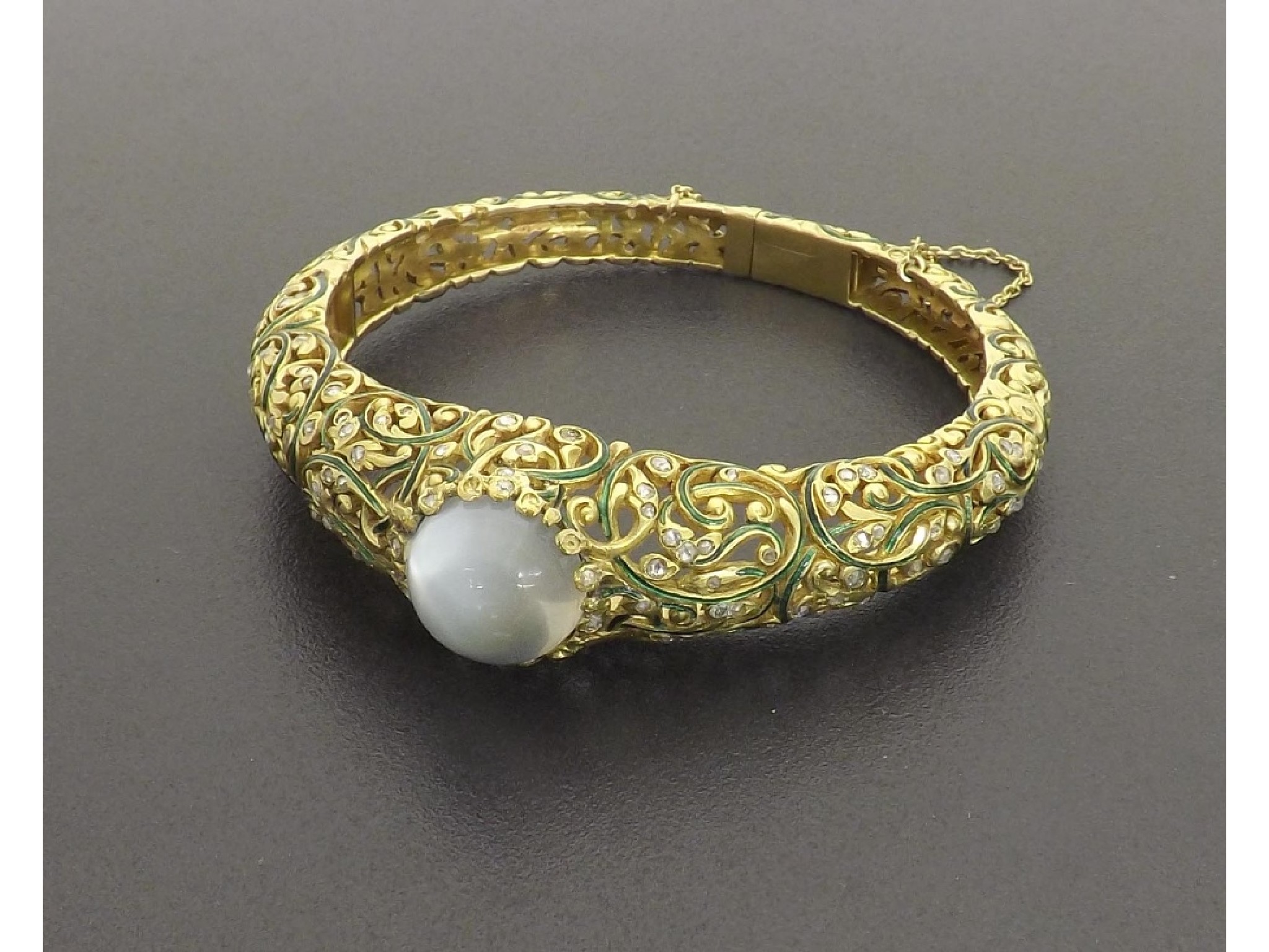 Appraisal: Fine gold and enamel hinged bangle set with a single